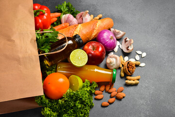 Delivery healthy food background. Healthy vegan vegetarian food in paper bag vegetables and fruits on white, copy space, banner. Shopping food supermarket and clean vegan eating concept.