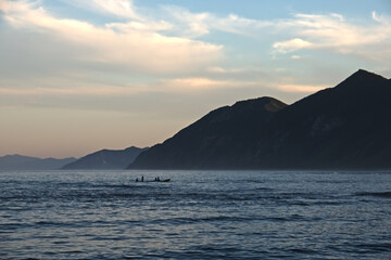 Fishermen return from ocean in evening