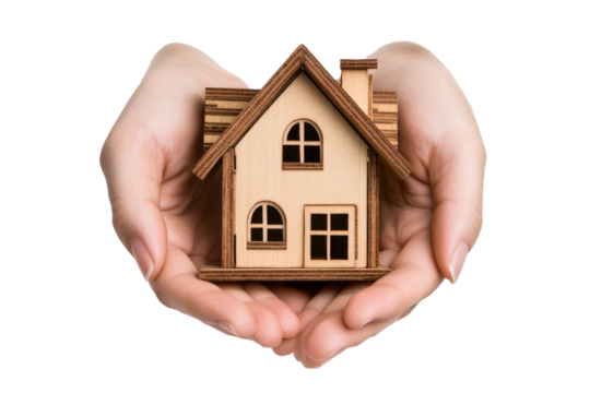 Holding a wooden house model in hands depicting care and craftsmanship in a clean, well-lit setting