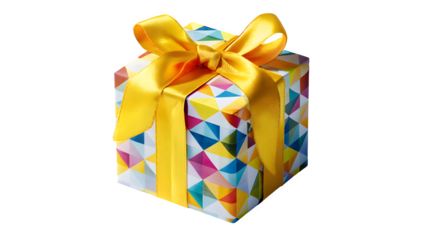 Close up of a gift wrapped in colorful geometric paper with a yellow ribbon and bow on top