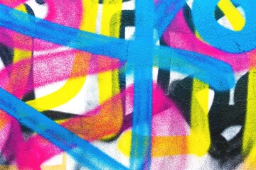 Bold graffiti style spray paint with neon blue, pink, yellow strokes. Modern urban 90s, vibrant colors, street art texture. Background, digital art, urban wall, creative banner.
