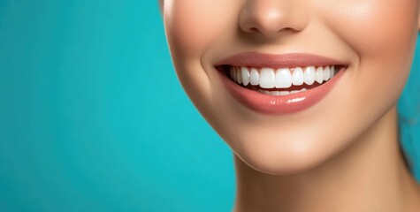 Close-up of woman’s broad smile with bright white teeth and glossy pink lips against teal background, representing dental health, oral care, beauty, and confident smile concepts.