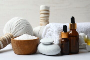 Spa and relaxation concept. Aromatherapy oil with candles in massage room