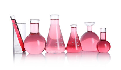 Laboratory glassware with pink liquid isolated on white