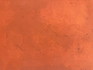 Red concrete texture background, close up view