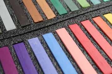 Set of colorful chalk pastels in box, closeup