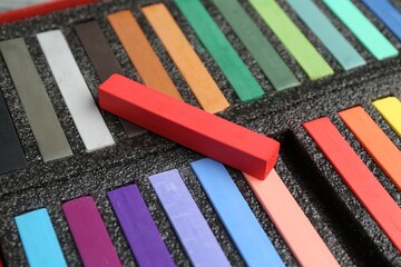 Set of colorful chalk pastels in box, closeup