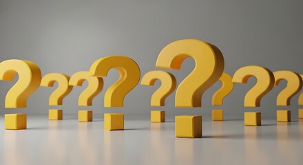 Many yellow question marks on a white surface against a gray background