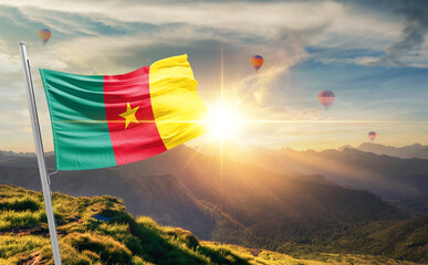 Cameroon flag waving in beautiful scenery. Cameroon national flag for independence day.