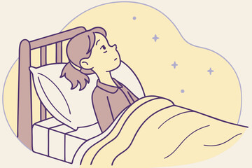 Girl lying in bed, not sleeping, thinking and turning her head