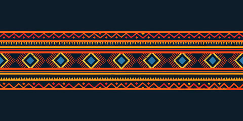 Vibrant geometric tribal pattern with diamonds and zigzags on dark blue background