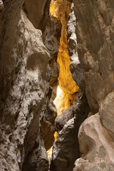 Vertical photo of a mountain range in Saitabat Gorge, Turkey. High resolution image of steep rocky cliffs and green slopes, ideal for travel, nature and landscape backgrounds