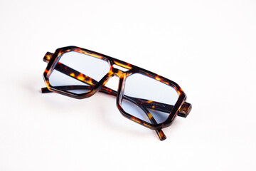 Stylish Round Black Sunglasses with Gold Frame on White Background Morocco AUGUST 13,2025