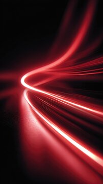 Red light trails in a dark tunnel