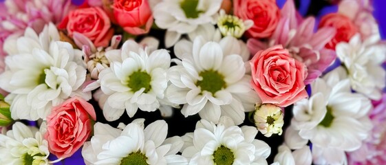 colorful flower arrangement in pink box