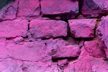 Close-up of pink painted brick wall texture.