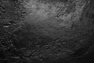 Dark, textured surface with subtle light variations (2)