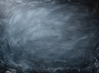 A dark gray chalkboard with streaks of lighter gray