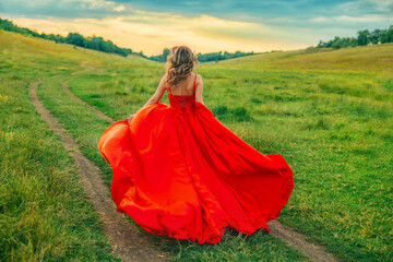 happy fantasy blonde hair woman queen running walking in green field summer nature sunset blue sky, long red dress fluttering skirt silk fabric waving fly slow motion joy girl princess back rear view
