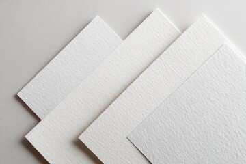 Three white textured paper sheets layered