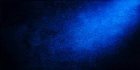 Dark blue vintage grunge wall texture with a rough and aged surface for a blank and textured background design