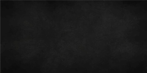 Textured black chalkboard surface with a vintage, grunge wall pattern for a blank and dirty backdrop