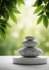 Obraz premium Balanced Stone Stack with Green Leaves | Zen Garden Still Life for Meditation, Wellness and Spa Concepts