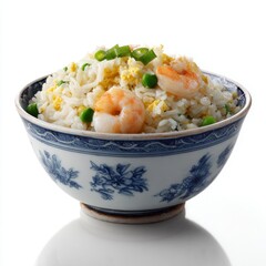 Delicious rice dish with shrimp, green peas, and scrambled eggs served in a traditional blue and white porcelain bowl for Asian cuisine meal