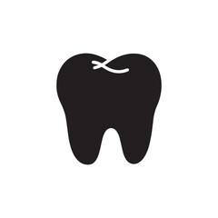 Solid black silhouette of a tooth on white Background. 