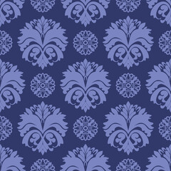 A sophisticated and luxurious seamless damask pattern featuring intricate floral and baroque ornaments in rich dark blue and indigo shades. This versatile vector texture is perfect for a wide range