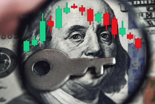 Abstract image of dollar banknote through magnifying lens and financial chart with candles. (Trading, secrecy, silence, investment - concept)