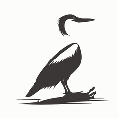 Elegant heron stands gracefully along the water's edge, a minimalistic silhouette