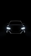 Fototapeta premium Front view of a sleek modern car with bright headlights and an illuminated body outline against a dark background.
