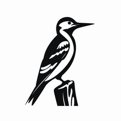 Obraz premium Isolated black woodpecker perched atop a wooden post, bird wildlife silhouette