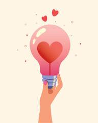 Hand holding light bulb with red heart design. Love light bulb design.
