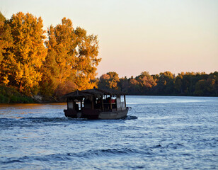Autumnal river boat sunset landscape