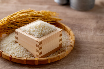 Japanese Rice in a Masu Box

A close-up of Japanese white rice in a traditional wooden masu box, with golden rice stalks in the background. This image captures the freshness and tradition of Japanese 