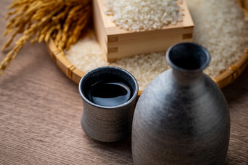 Sake and Japanese Rice

A close-up of a traditional Japanese sake flask and cup with white rice and golden rice stalks in the background. This image highlights the connection between sake and Japanese