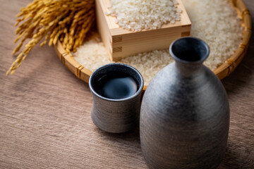 Sake and Japanese Rice

A close-up of a traditional Japanese sake flask and cup with white rice and golden rice stalks in the background. This image highlights the connection between sake and Japanese