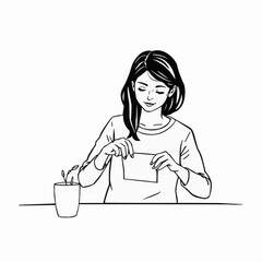  The girl opens the package at the table. 