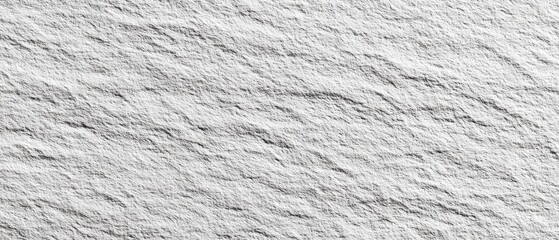 Textured light gray stone surface with rippled patterns