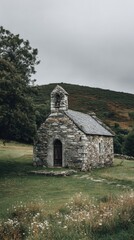 A quaint chapel stands in a lush green landscape