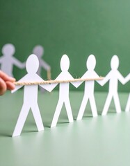Teamwork, Tug-of-War, Paper Figures, Green Background