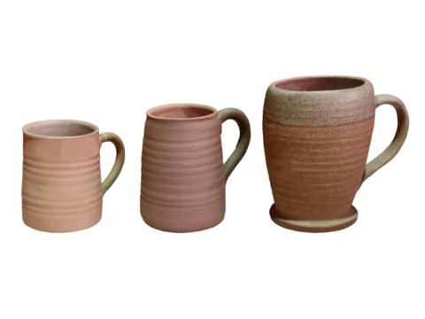 Close-up of three different shaped clay cups used for drinks isolated on transparent background png file.