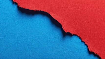 Close-up torn blue paper in wave-like shape revealing solid red background, high contrast abstract texture for modern advertising, branding, and creative graphic design projects
