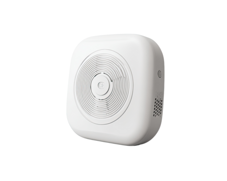 White square portable device, likely a smoke detector.  Circular speaker grille and small hole visible