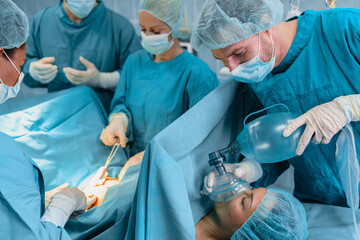 Surgical Team Working Together During Complex Medical Procedure In Hospital Operating Theater With Specialized Equipment