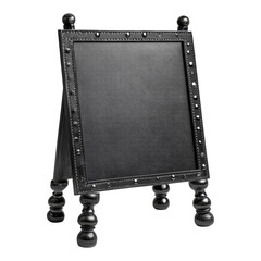 Obraz premium Decorative black chalkboard stand with ornate edges displayed on a wooden surface