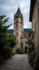 Fototapeta premium Historic church tower in a quaint village street