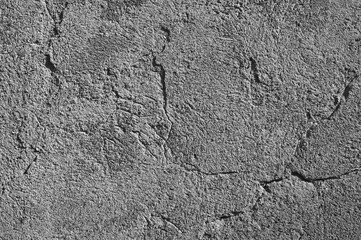 gray background, in the photo the texture of an old concrete plastered wall with cracks